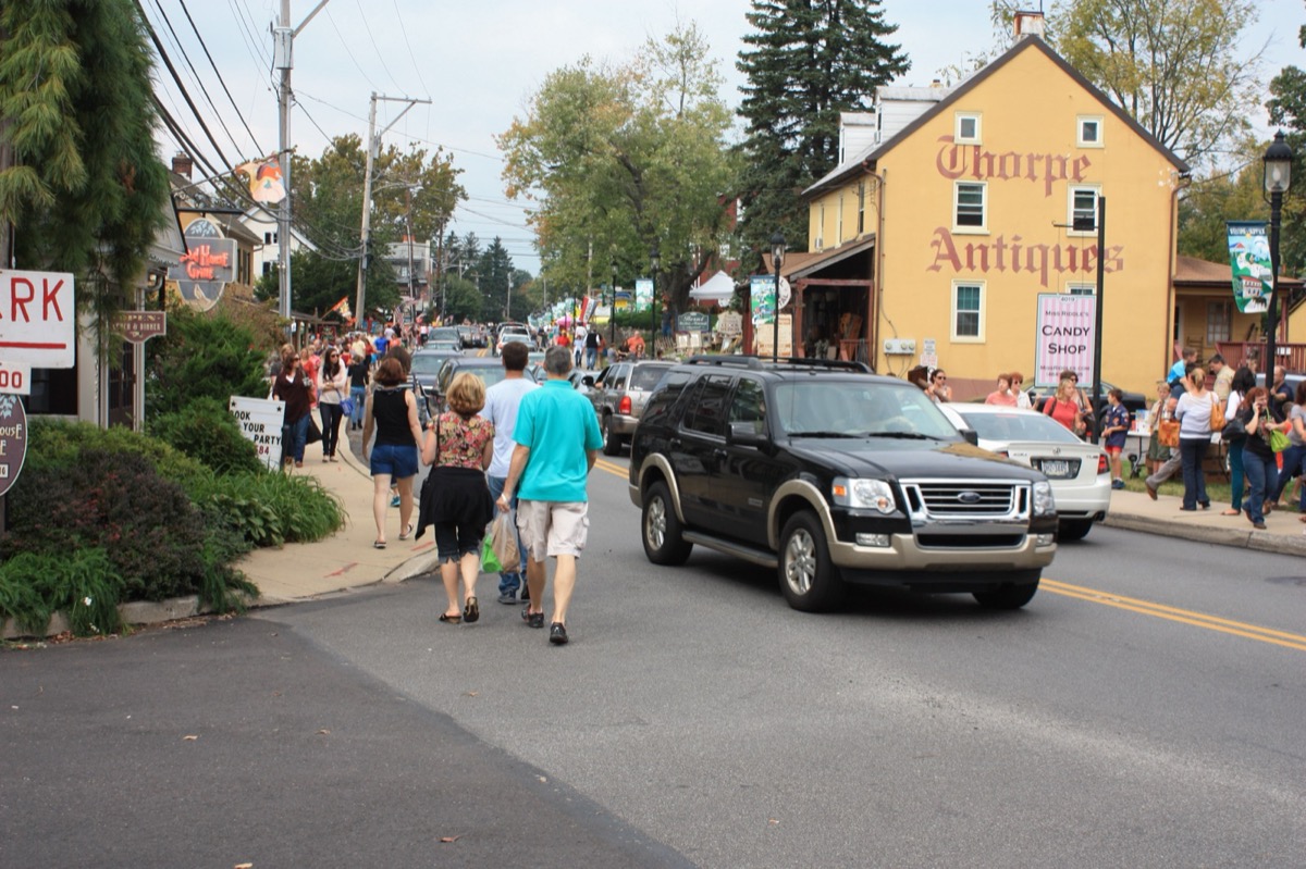 Historic shop storefronts along Skippack Pike during a village festival, Montgomery County PA